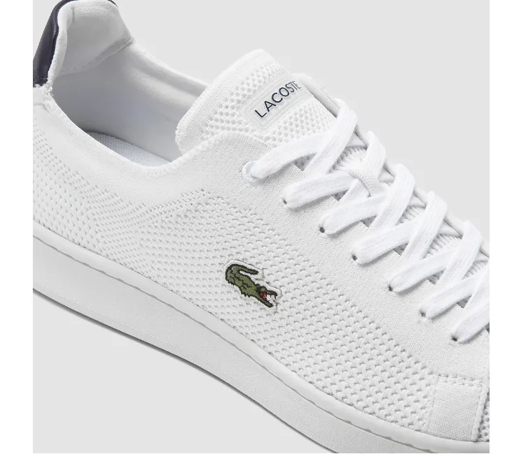 Men's Lacoste Carnaby Piquee 123 (White/Navy) running with knee braces